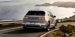 Rear view of a silver 2022 Hyundai Ioniq 5 being driven on the highway. | Hyundai dealer in Fort Smith, AR.