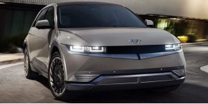 Front view of a light grey 2022 Hyundai Ioniq-5 being driven on the road. | Hyundai dealer in Fort Smith, AR.