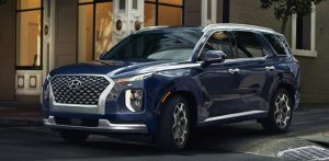 Profile view of a parked, dark blue 2022 Hyundai Palisade. | Hyundai dealer in Fort Smith, AR.