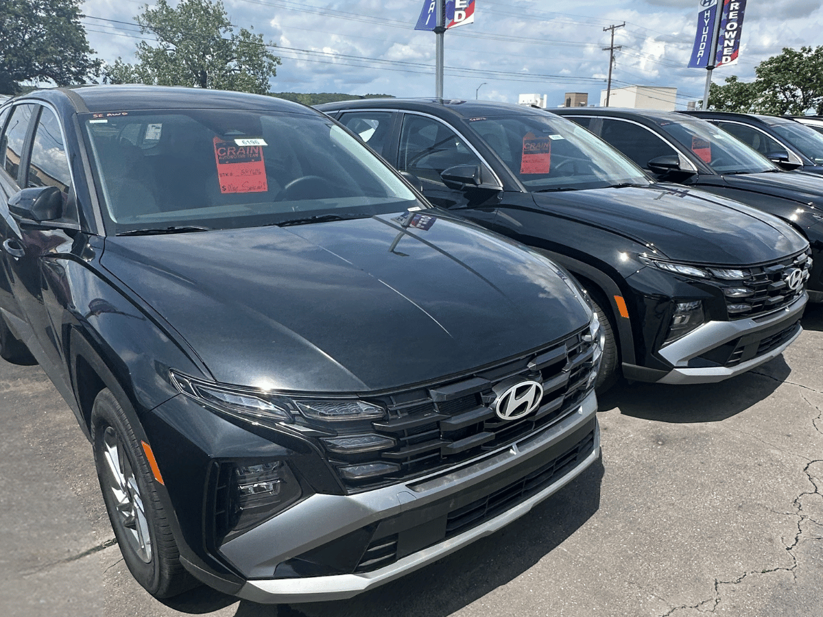 Hyundai Tucson for sale at Crain Hyundai of Fort Smith, lined up under sunny skies
